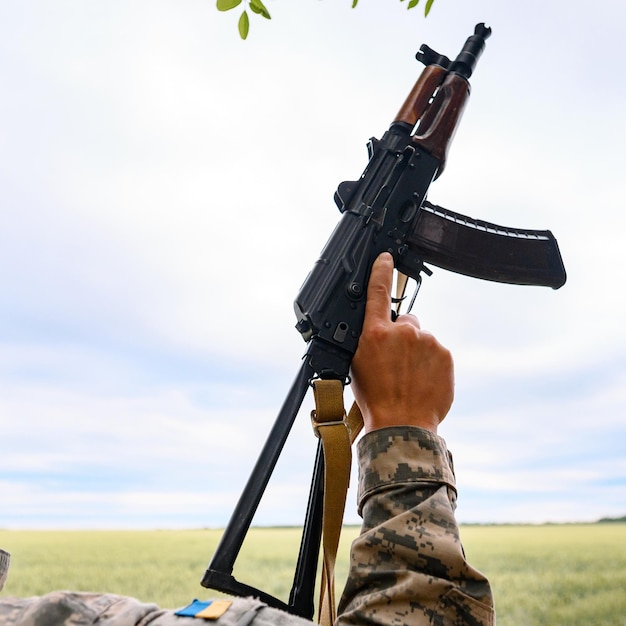 The Ukrainian military holds a submachine gun