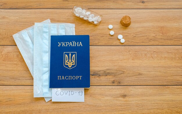 Украинский паспорт с надписью Covid-19, Защитные маски и таблетки