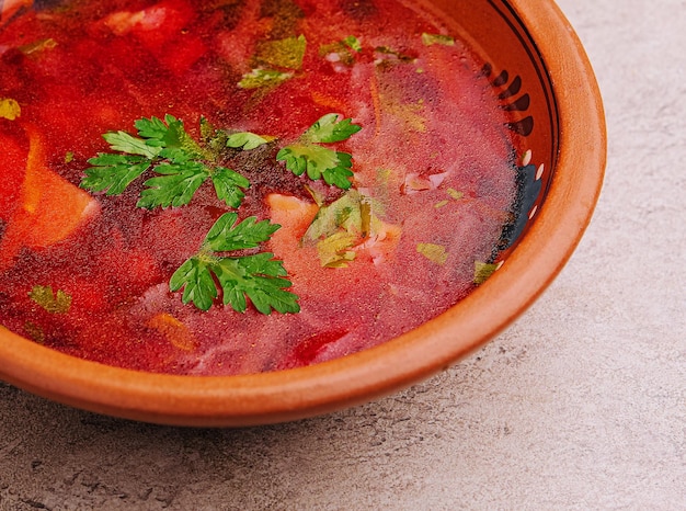 Ukrainian red borscht soup in a rustic bowl