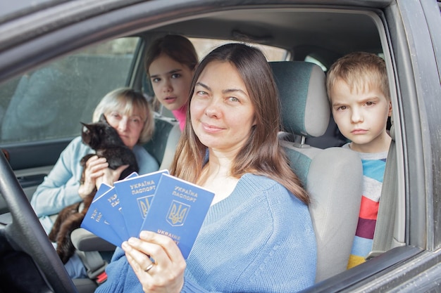 Ukrainian refugees flee from russian invasion cross board by car together with pet seek protection