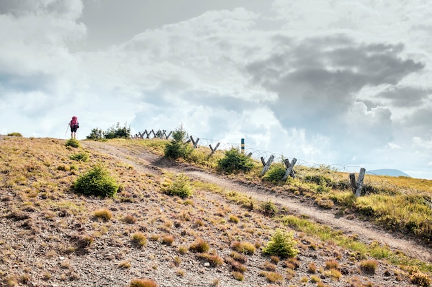 Ukrainian-Romanian border in the Carpathian mountains, Hiker overcomes a tourist route