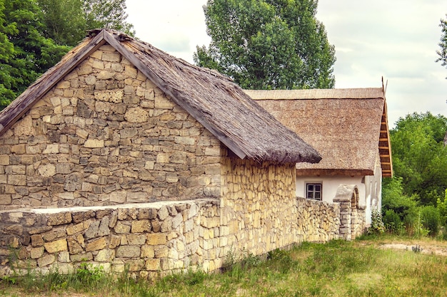Ukrainian stone house under a thatched roof