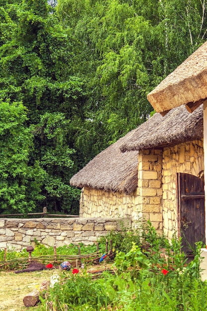 Ukrainian stone house under a thatched roof