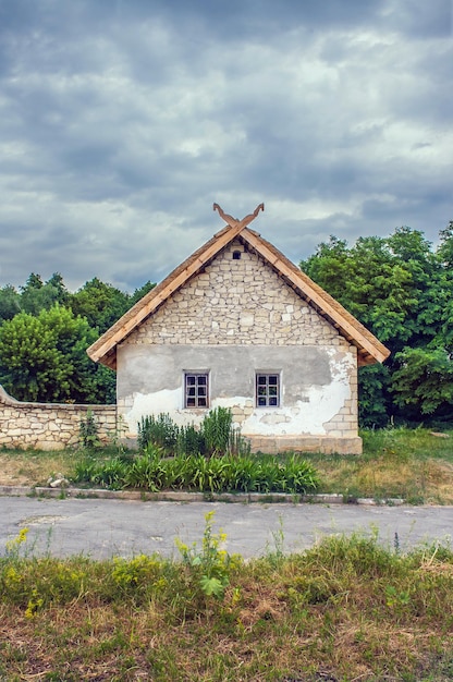 Ukrainian stone house under a thatched roof