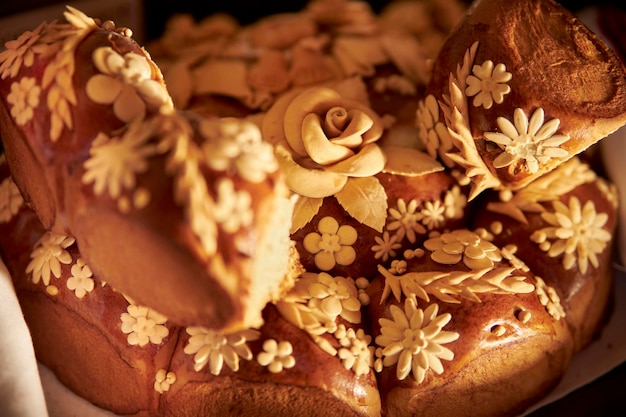 Ukrainian traditional holiday bread - loaf, close-up. Ukrainian decorated fresh bread with salt.