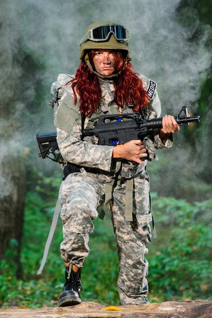 Ukranian female soldier in the forest