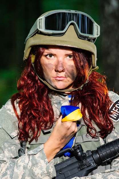 Ukranian female soldier in the forest