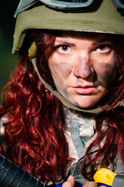 Ukranian female soldier in the forest