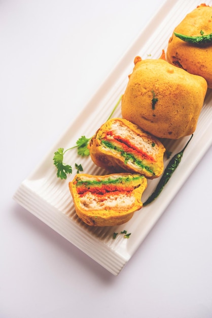 Ulta vada pav is made with a spicy potato stuffed bun called\
pav inside vada inside out wada pao