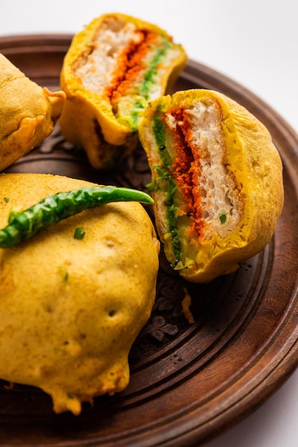 Ulta vada pav is made with a spicy potato stuffed bun called\
pav inside vada inside out wada pao