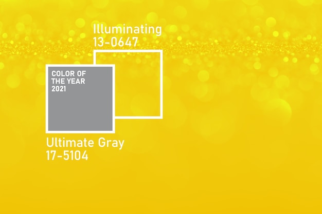 Ultimate Grey and Illuminating colors of the year 2021. Color trend palette. Stylish Gold defocused glitter background with bokeh.