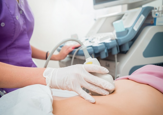 Ultrasound scanner in the hands of a doctor.