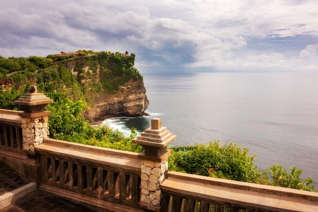 Uluwatu cliff on ocean coast on Bali island Indonesia