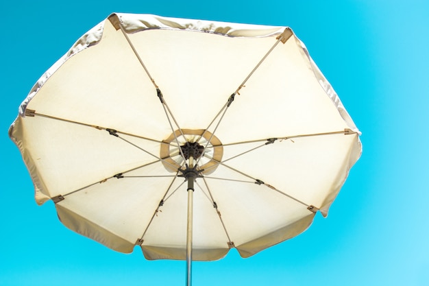 Umbrella and blue summer sky