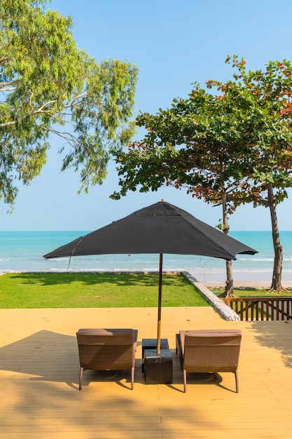 Umbrella and chair neary sea and beach