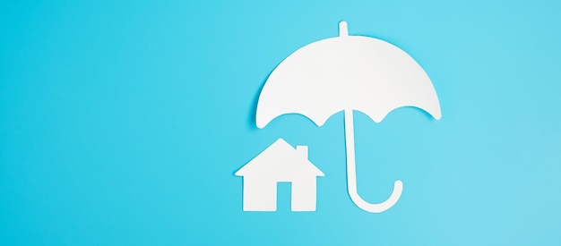 Umbrella cover Home paper on blue background Warranty Maintenance real estate and insurance concept