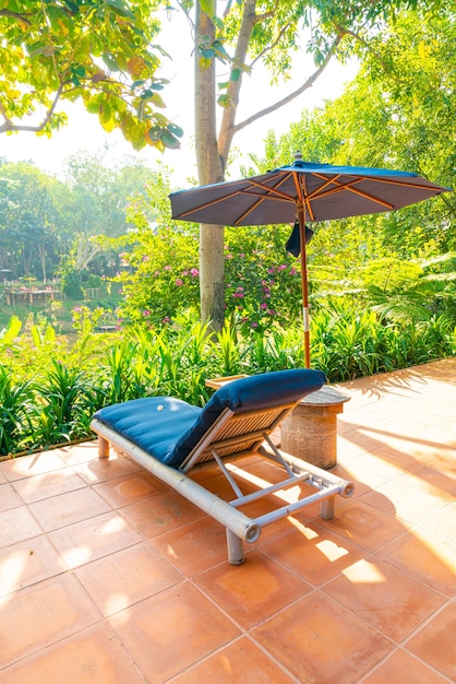 umbrella and pool bed around swimming pool with river view