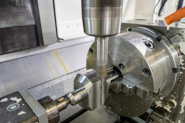 Unadorned photo of automated milling metal part on cnc machine