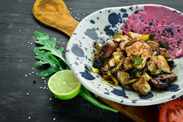 Unagi Salad with chicken mushrooms vegetables and pumpkin seeds On a wooden background Top view Free space for your text