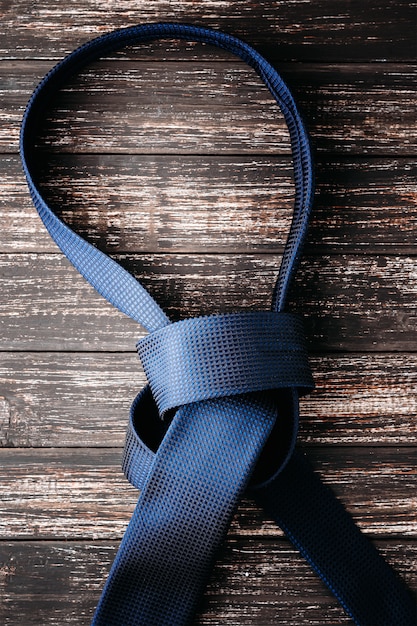 Unbound tie knot on dark background