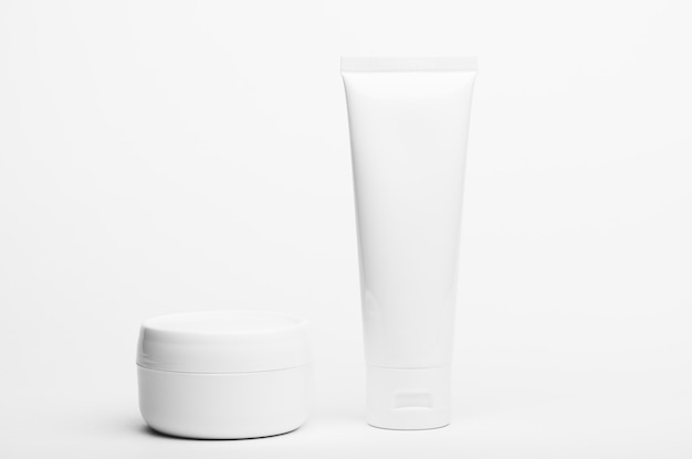 Unbranded plastic tube and jar. Flacon for cream, body lotion, toiletry.