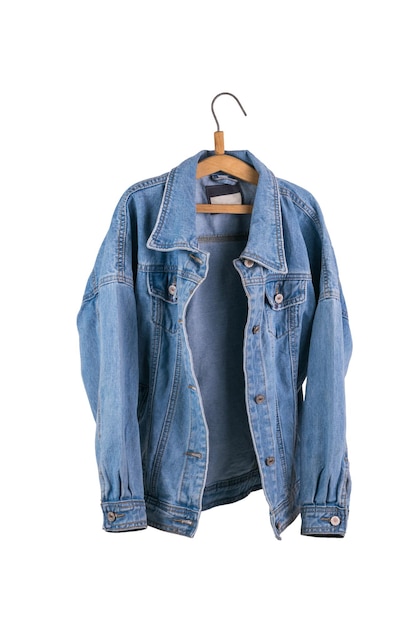 Unbuttoned women's denim jacket on a hanger isolated on a white background