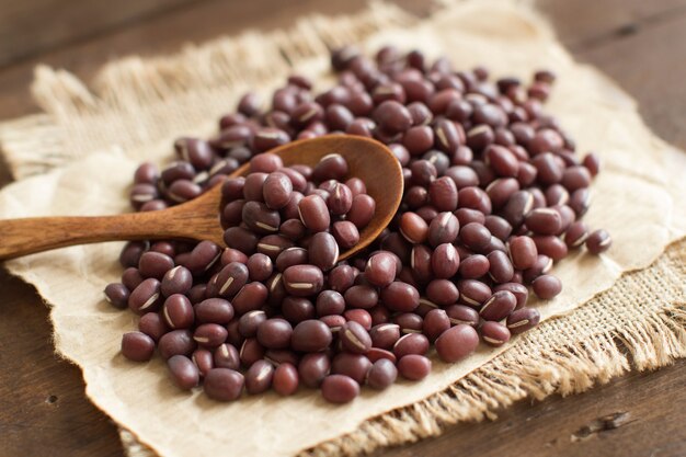 Uncooked azuki beans with a spoon close up