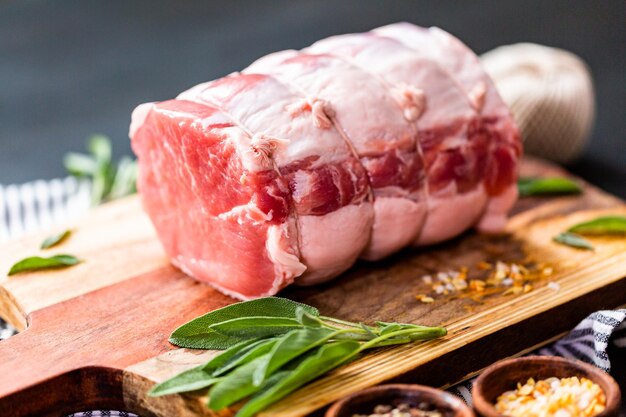 Uncooked boneless pork roast on the cutting board.