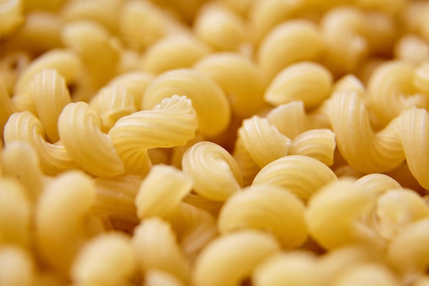 Uncooked Cavatappi Italian Pasta closeup selective focus
