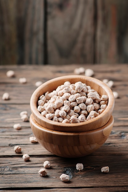 Uncooked chickpea on the vintage table