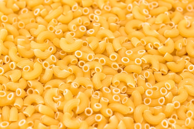 Uncooked chifferi rigati pasta background