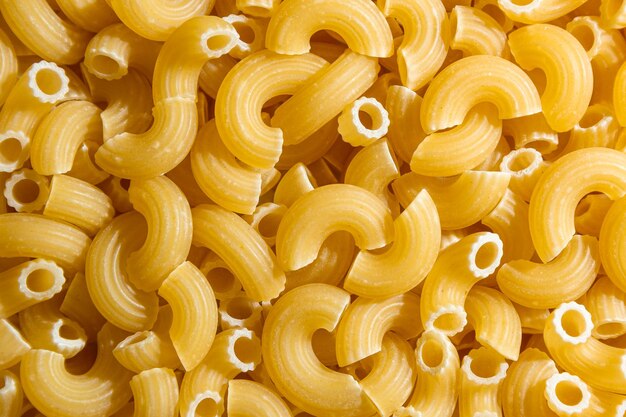 Uncooked chifferi rigati pasta background