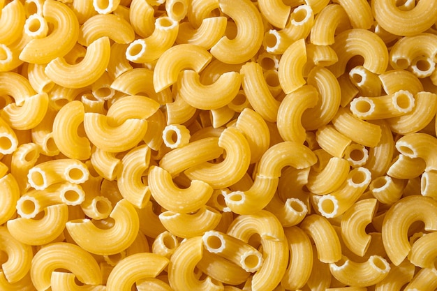 uncooked chifferi rigati pasta background