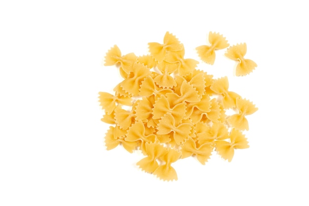 Uncooked farfalle pasta isolated on white