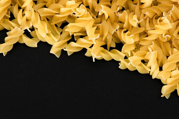 Uncooked fusilli pasta with copy space