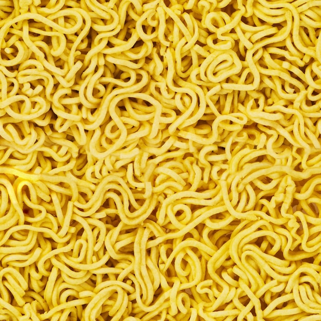 Uncooked instant noodles seamless texture in natural color