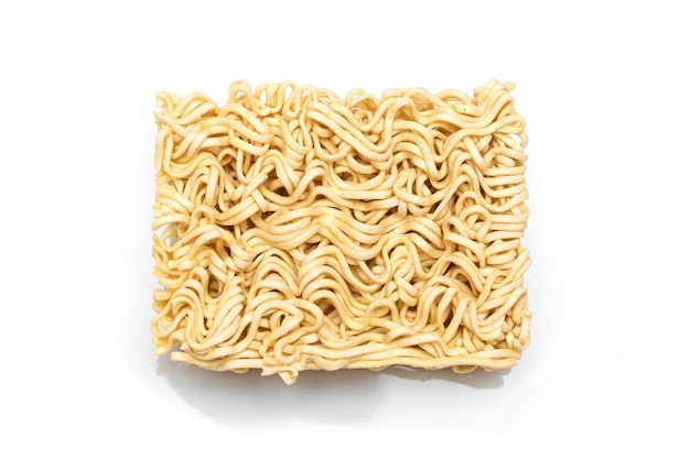 Uncooked instant noodles on white plate