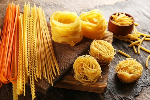 Uncooked pasta on cutting board closeup