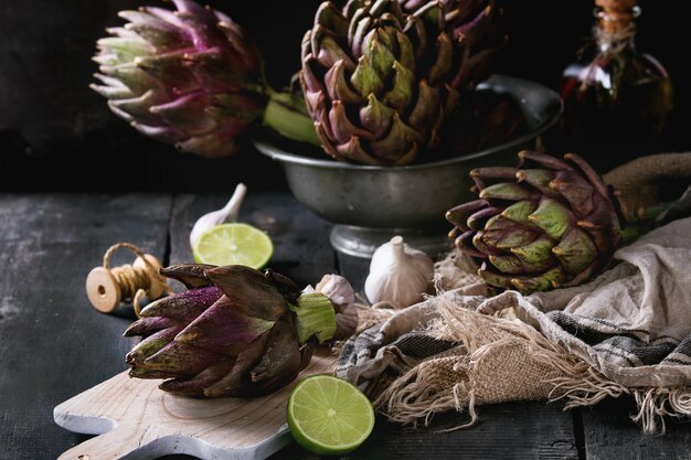 Uncooked purple artichokes