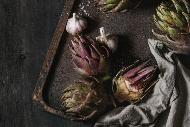 Uncooked purple artichokes