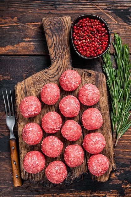 Uncooked raw beef and pork meatballs