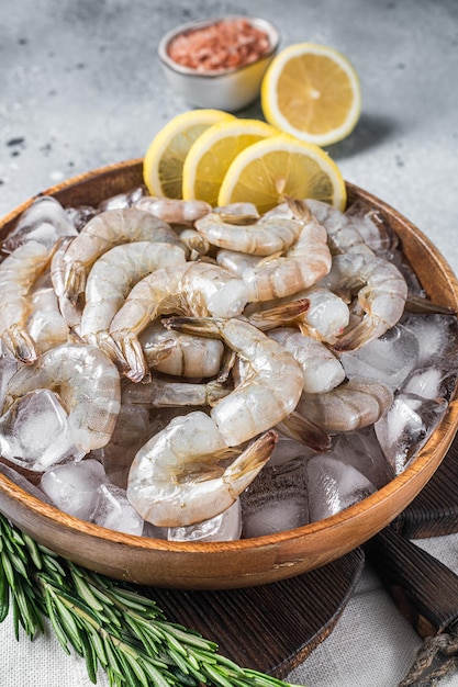 Uncooked Raw peeled tiger white shrimp prawn Gray background Top view