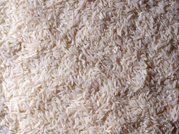 Photo uncooked rice grits, cooking concept, food background