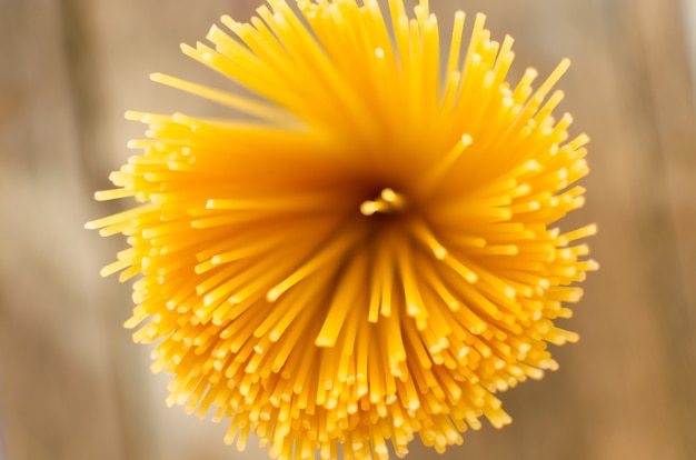 Uncooked spaghetti top view close up horizontal photo