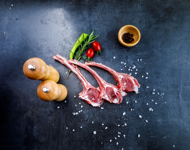 Uncooked steak on dark backdrop