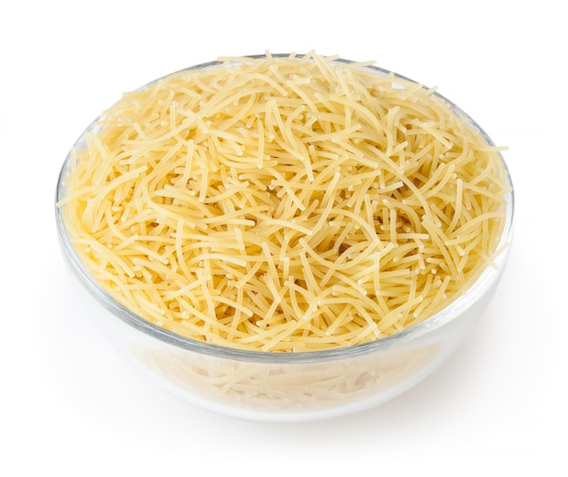 Uncooked vermicelli pasta in glass bowl isolated on white background with clipping path