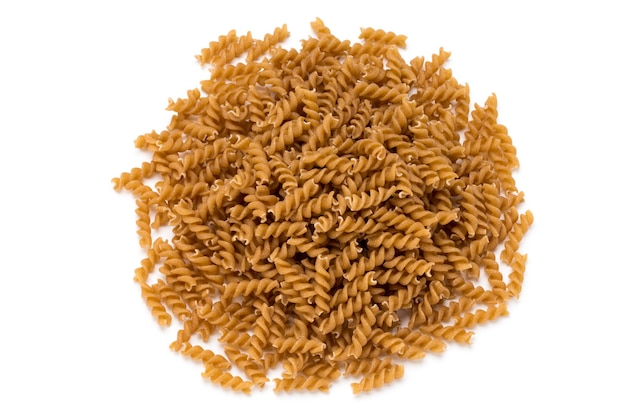 Uncooked wholemeal pasta isolated