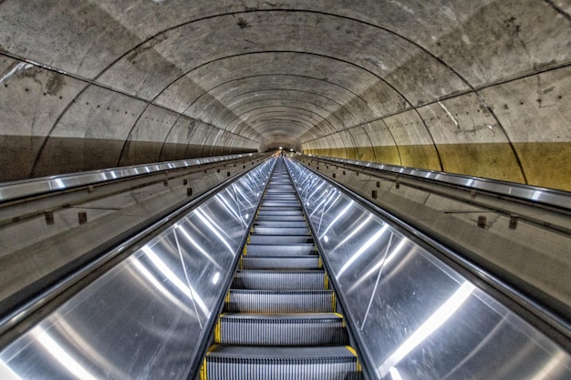 Underground Metro subway moving escalator