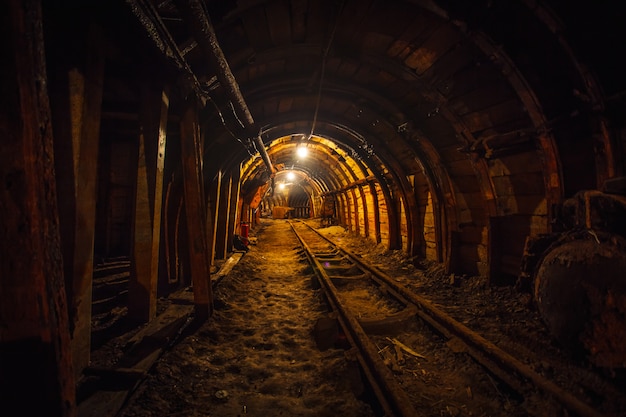 Underground mining tunnel with rails