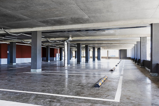 Photo underground parking is located under the residential building. a place for parking and storage of personal vehicles of residents of a multi-storey building.
